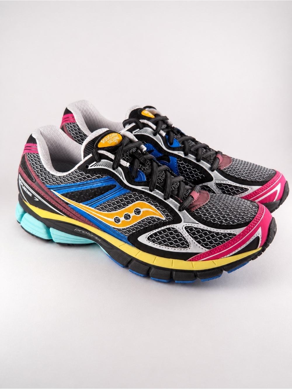 Size 9.5M- Saucony ProGrid Running Sneakers with Pink, Yellow & Blue Accents